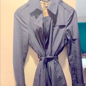 Burberry trench coat above the knee length.